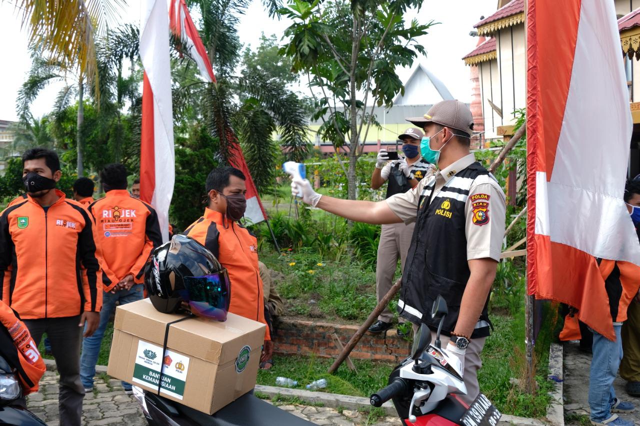  Peduli covid 19  serentak Polda RIAU laksanakan gerakan bhakti sosial