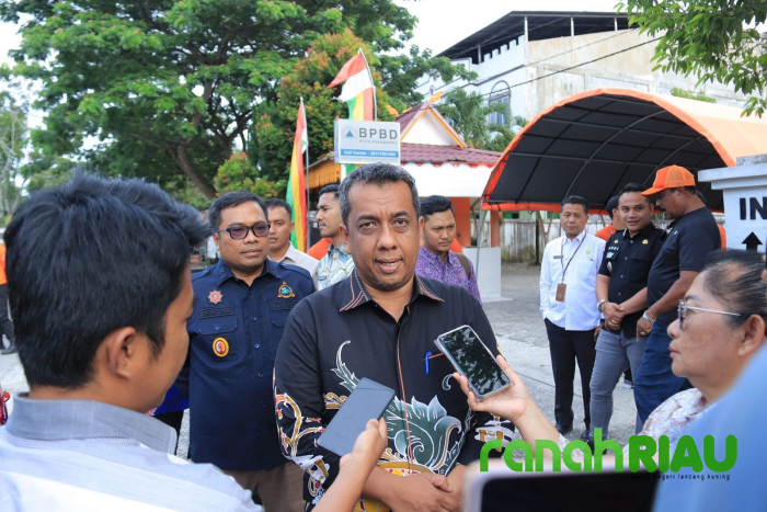 Antisipasi Banjir dan DBD, Pj Walikota Pekanbaru Ajak Masyarakat Bersihkan Lingkungan