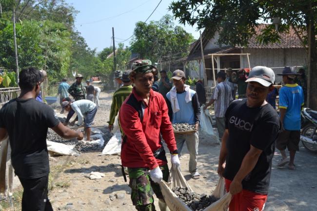 TMMD 104 Buat Pelangi Diatas Jembatan Desa Bakubakulu