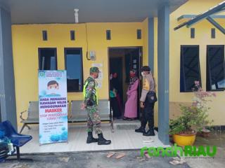 Babinsa dan Bhabinkamtibmas Sosialisasi dan Pengecekan Pos COVID-19