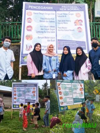 Kukerta Relawan Universitas Riau pasang baliho Sosialisasi Covid 19 di Hulu Kuantan