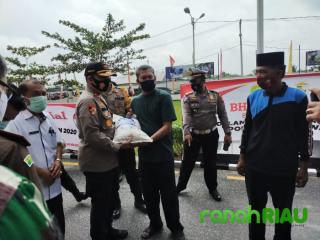 Kapolsek Ukui hadiri apel Pelepasan bansos di Mapolres Pelalawan